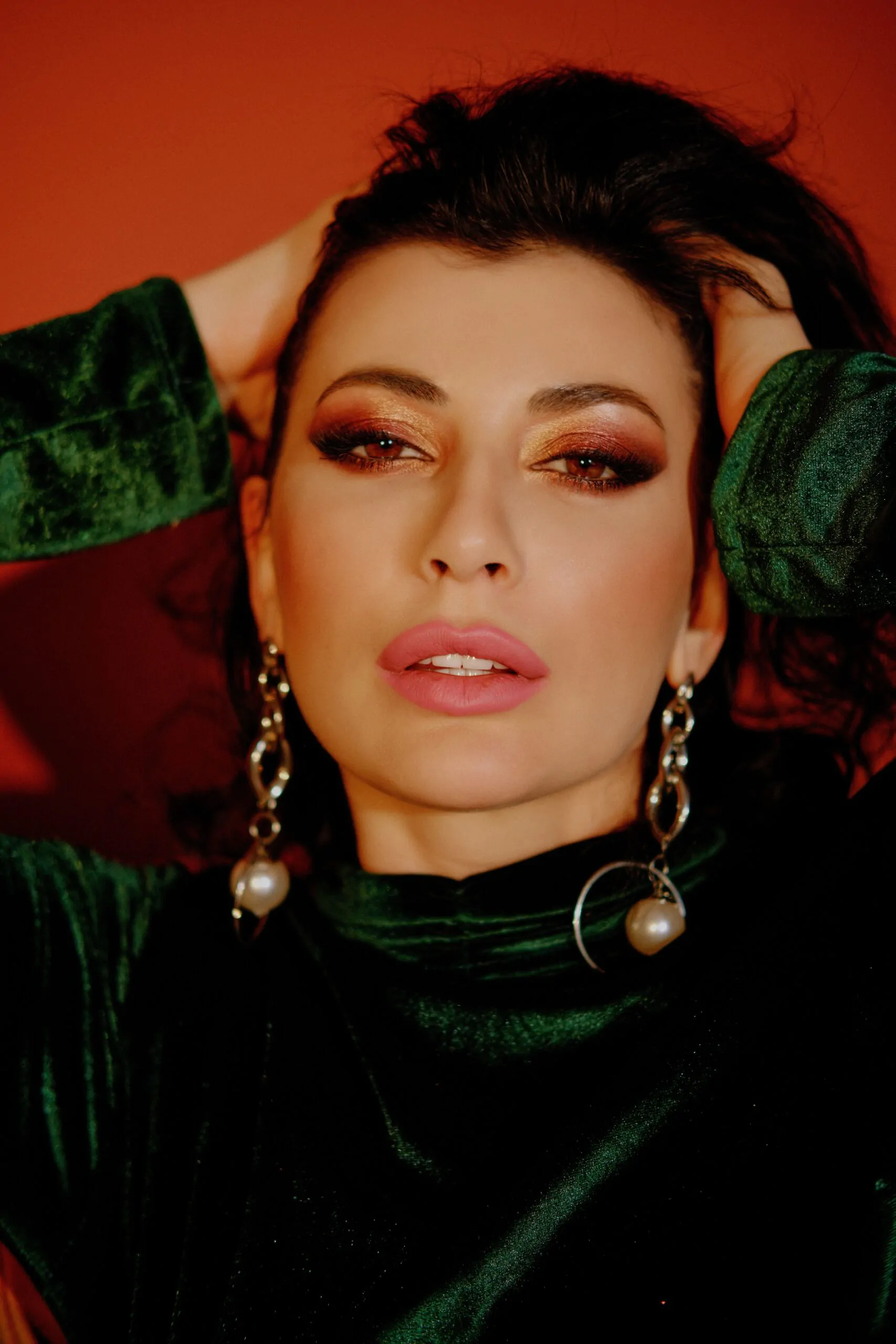 Refined occasion makeup featuring defined eyes and a bold lip color